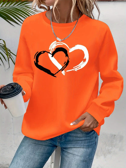 Sweatshirt med hjärttryck – Lekfull komfort med kärleksfull stil